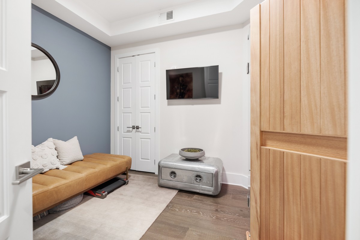 20 Rutledge Street, Unit 407 Nashville, TN 37210 - Photo 35 of 56 a living room with furniture and a flat screen tv