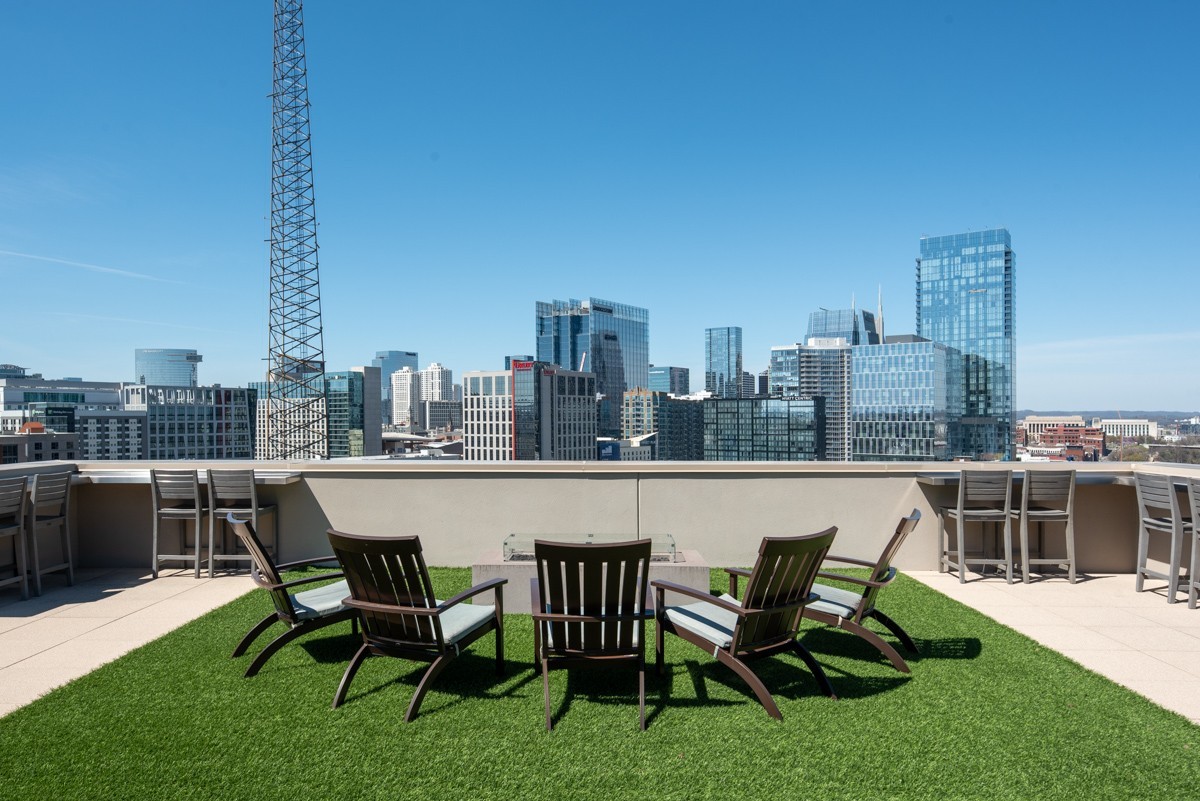 20 Rutledge Street, Unit 407 Nashville, TN 37210 - Photo 41 of 56 a view of a terrace with chairs and a table