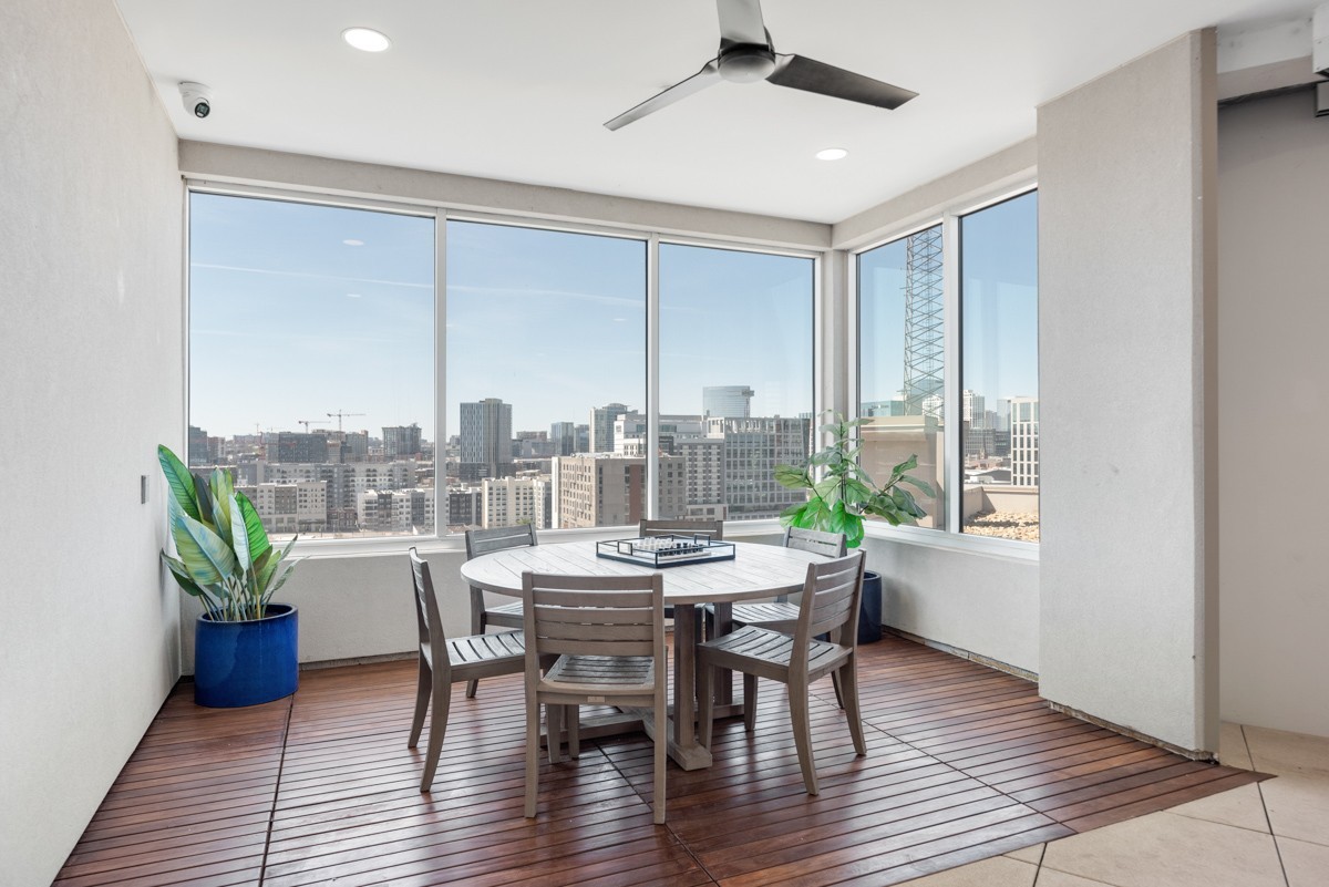 20 Rutledge Street, Unit 407 Nashville, TN 37210 - Photo 47 of 56 a view of a dining room with furniture window and wooden floor