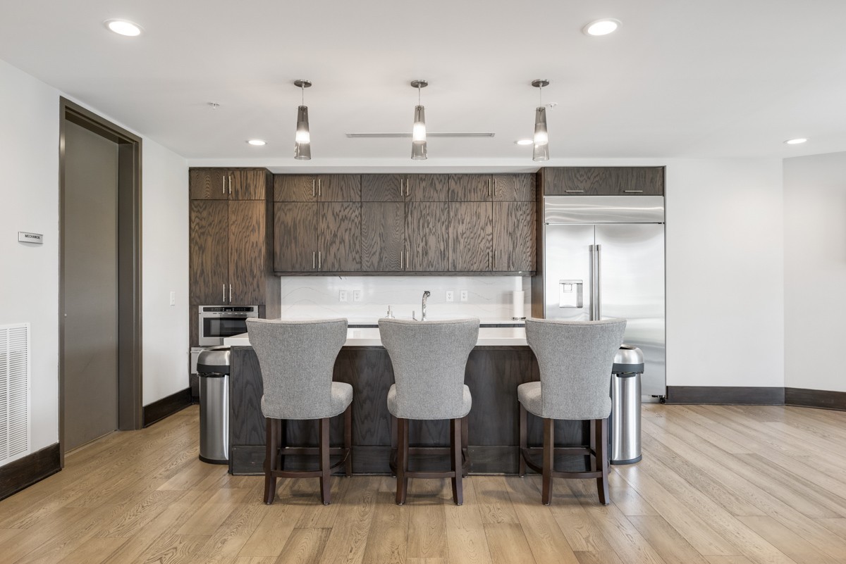 20 Rutledge Street, Unit 407 Nashville, TN 37210 - Photo 49 of 56 a view of a dining room with furniture and wooden floor
