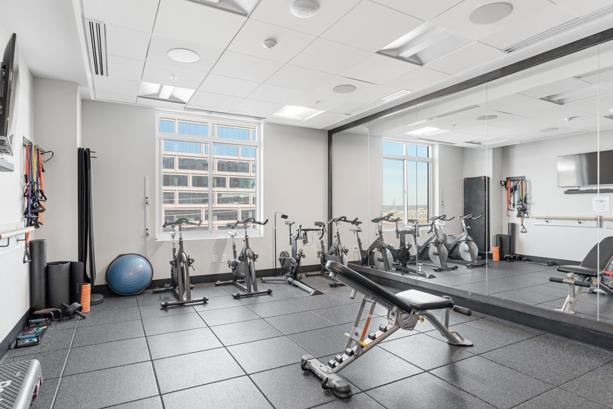 20 Rutledge Street, Unit 407 Nashville, TN 37210 - Photo 51 of 56 a room with gym equipment and glass door