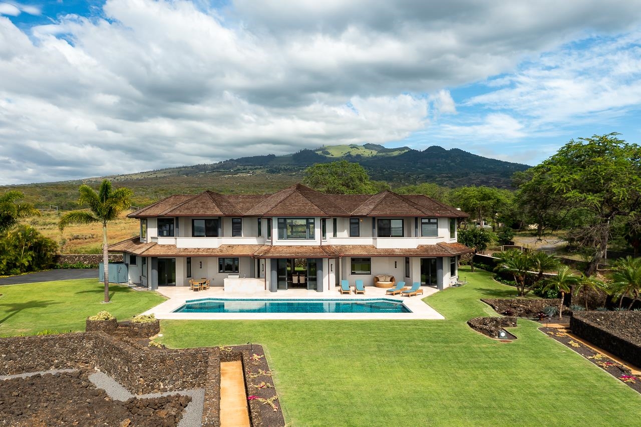 7595 Makena Road Kihei, HI 96753 - Photo 14 of 39 a front view of a house with swimming pool having outdoor seating
