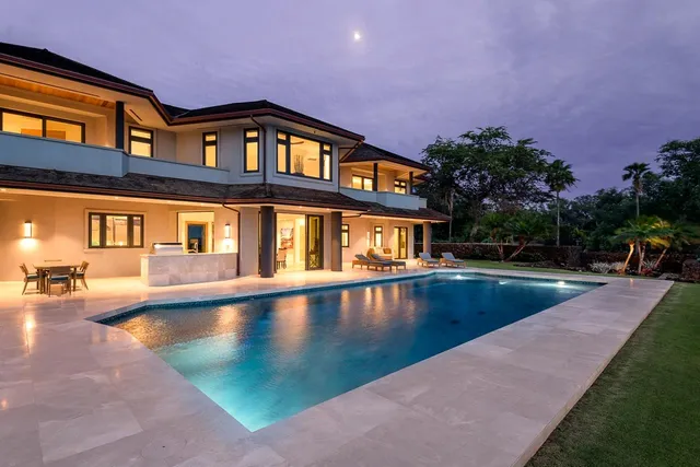 a view of pool with a yard