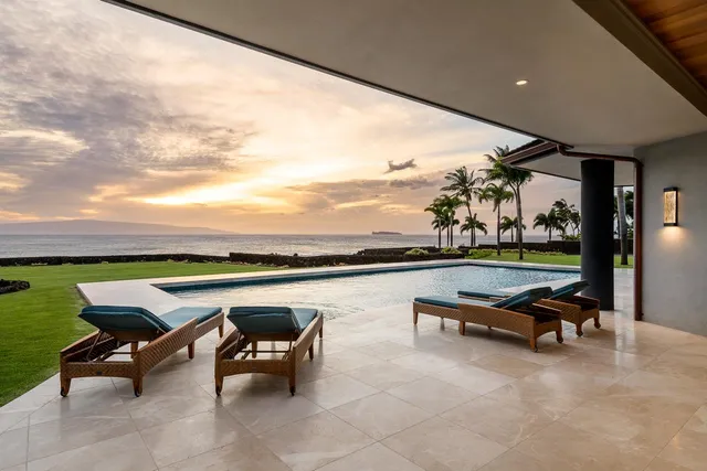 a view of swimming pool with outdoor seating