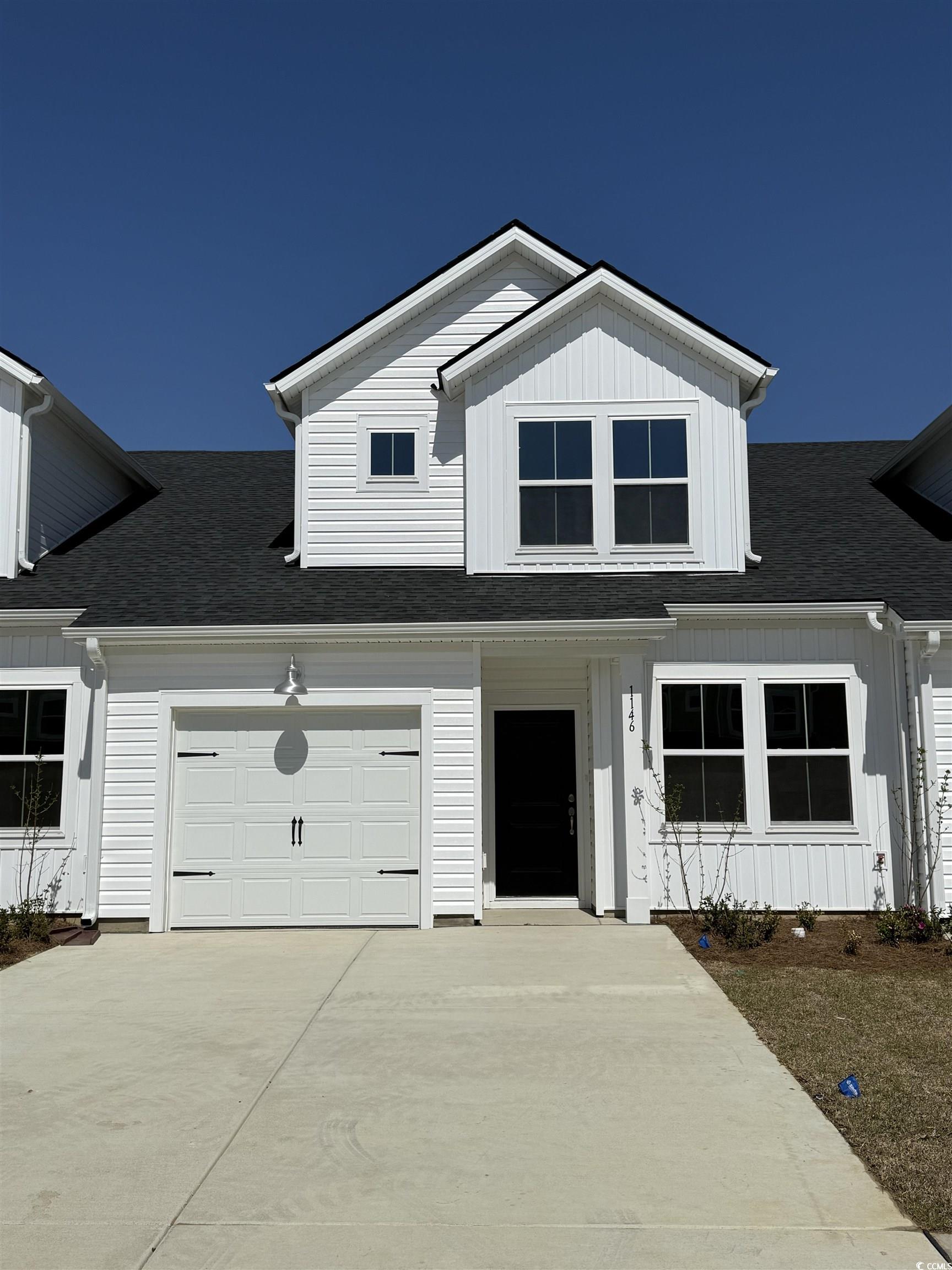 Modern inspired farmhouse featuring board and batt
