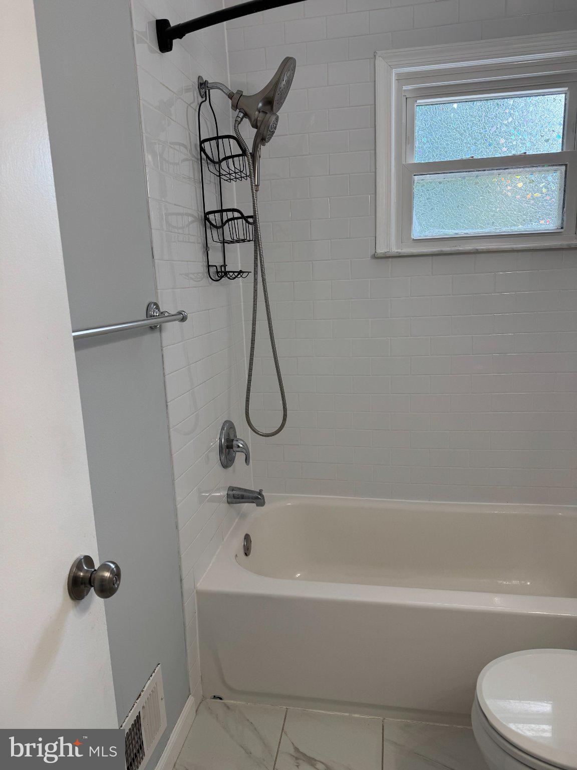 6603 Huntsman Boulevard Springfield, VA 22152 - Photo 27 of 64 Modern bathroom with sleek fixtures.