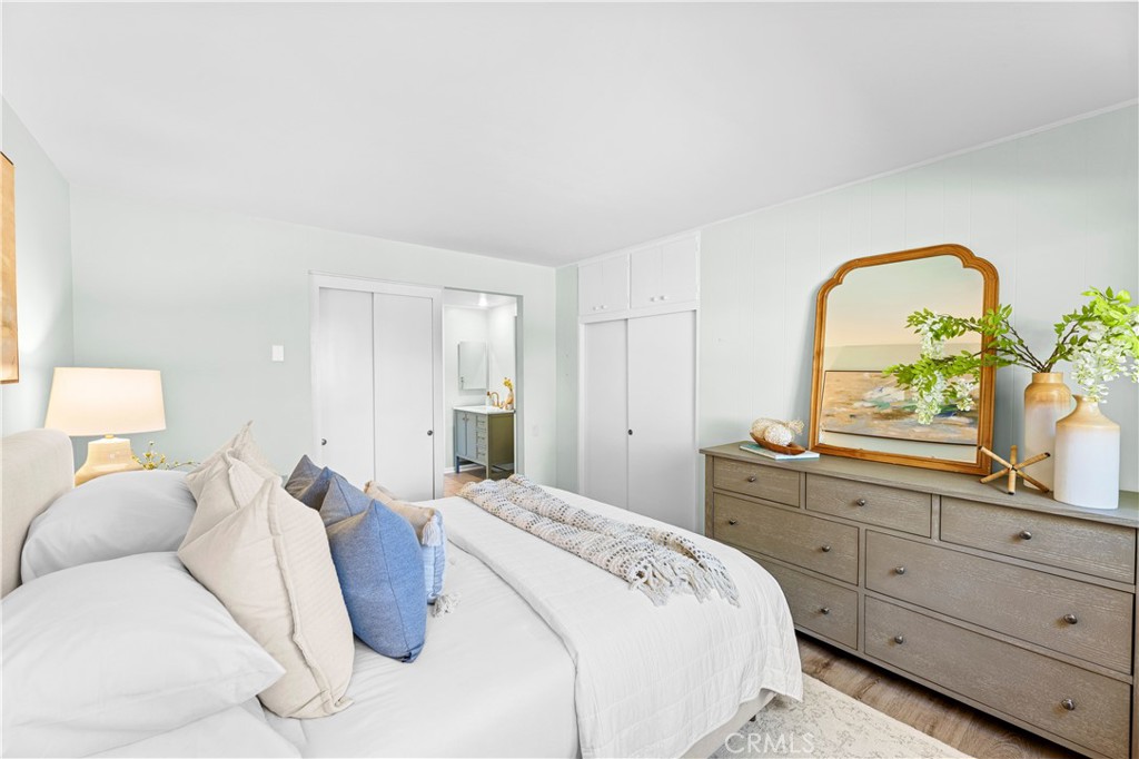 841 Ronda Sevilla, Unit B Laguna Woods, CA 92637 - Photo 18 of 37 a bedroom with a bed and a dresser