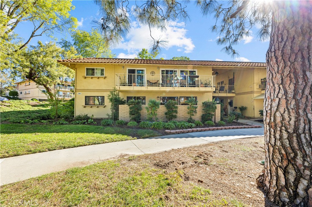 841 Ronda Sevilla, Unit B Laguna Woods, CA 92637 - Photo 27 of 37 front view of house with a yard
