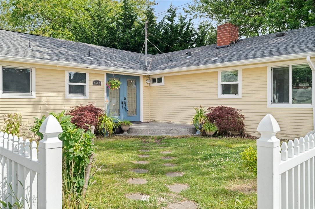 5308 Northeast 4th Street Renton, WA 98059 - Photo 1 of 27 a front view of a house with garden