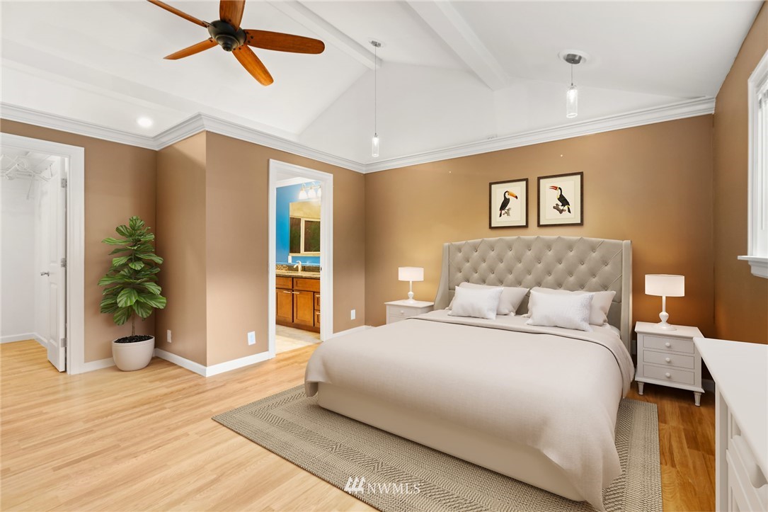 5308 Northeast 4th Street Renton, WA 98059 - Photo 14 of 27 a bedroom with a large bed and potted plant