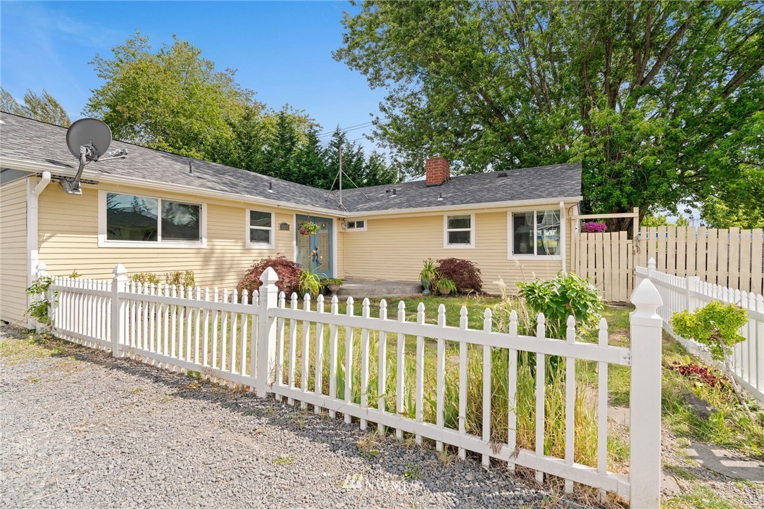 5308 Northeast 4th Street Renton, WA 98059 - Photo 3 of 27 a view of a house with wooden fence