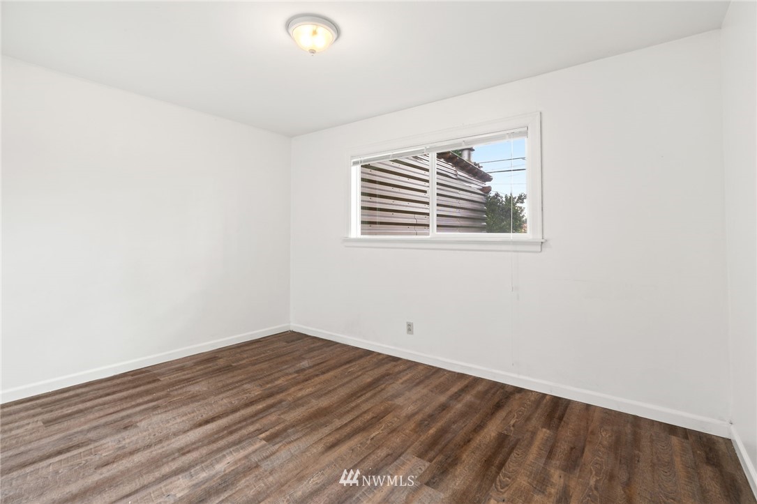 5308 Northeast 4th Street Renton, WA 98059 - Photo 22 of 27 an empty room with wooden floor and windows