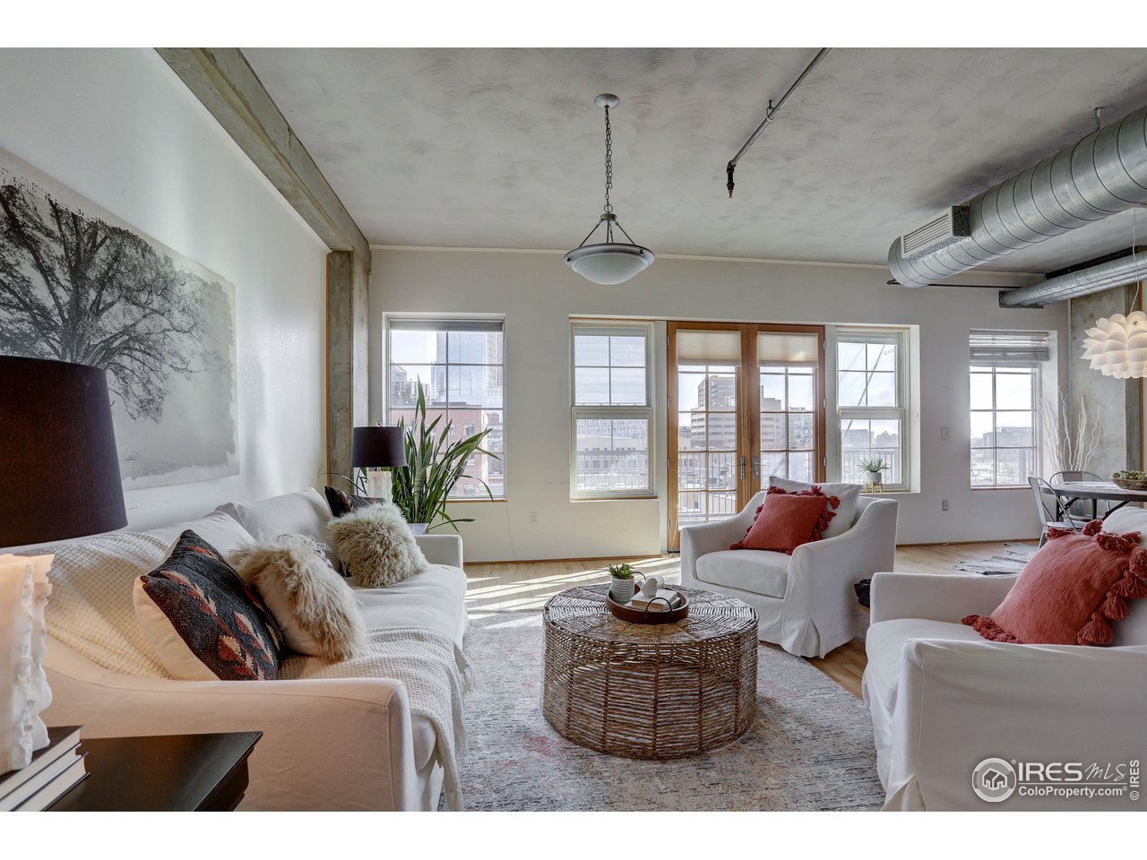 1499 Blake Street, Unit 6G Denver, CO 80202 - Photo 17 of 37 a living room with furniture and a large window