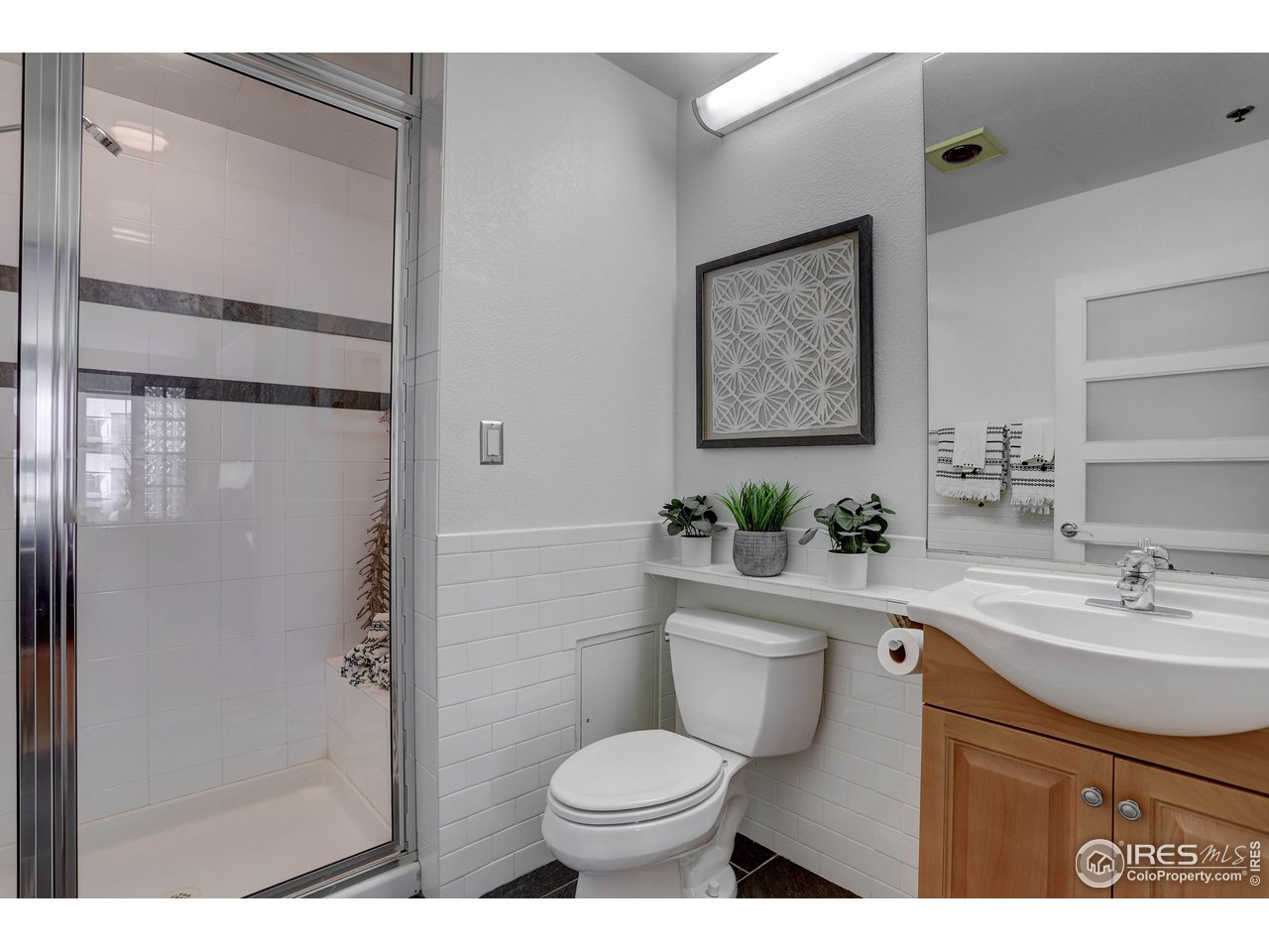 1499 Blake Street, Unit 6G Denver, CO 80202 - Photo 26 of 37 a bathroom with a toilet sink and shower