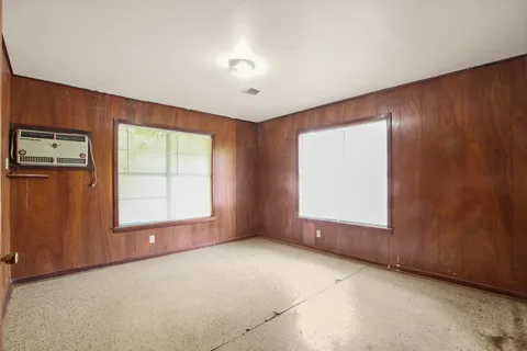 an empty room with windows