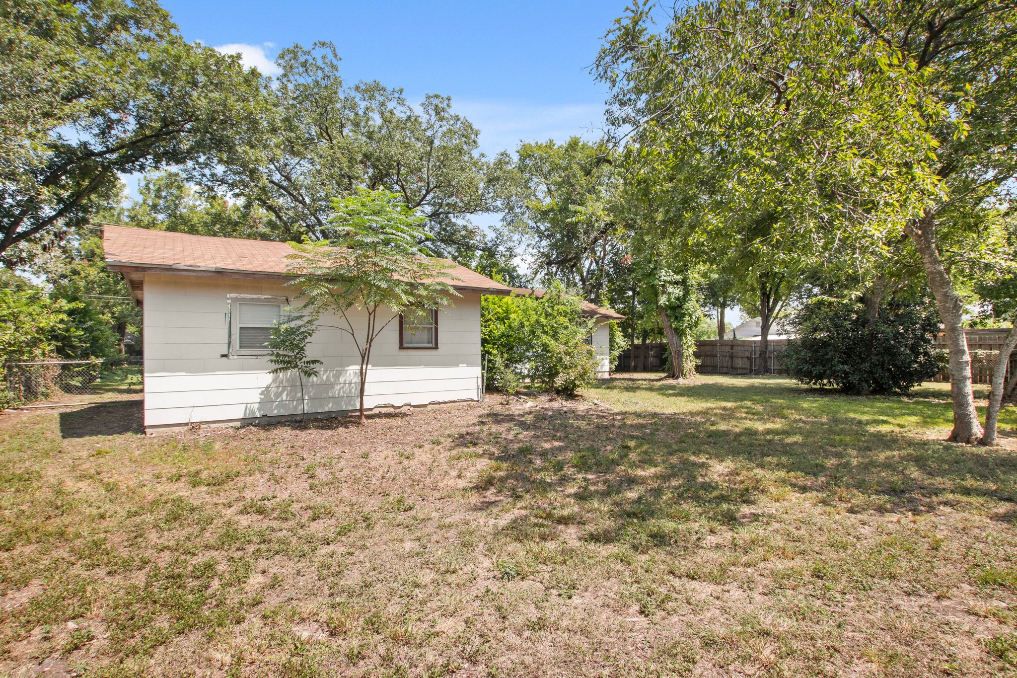 1007 Kimbro Street Taylor, TX 76574 - Photo 22 of 32 a front view of a house with a yard and garage