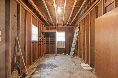 a view of a house with yard and a tree