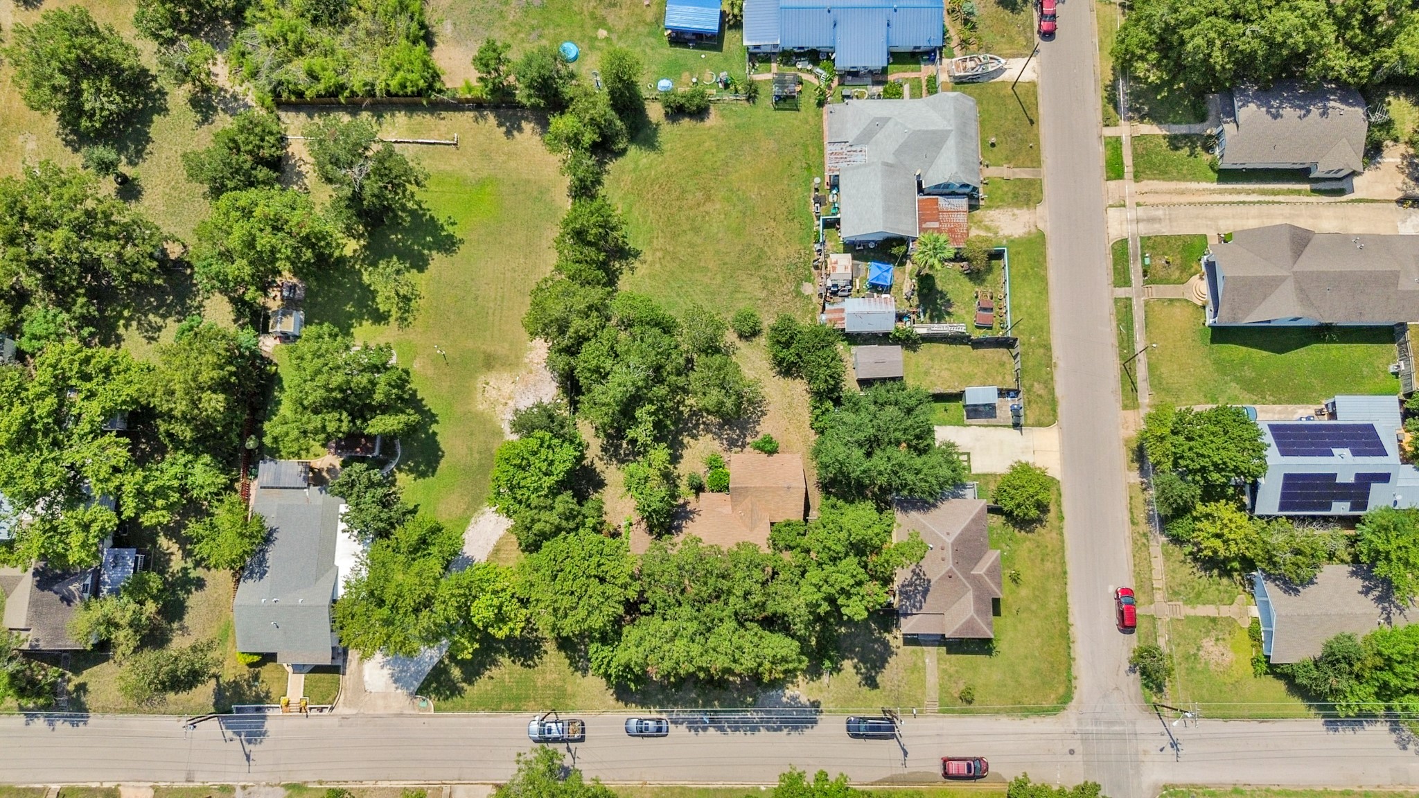 1007 Kimbro Street Taylor, TX 76574 - Photo 27 of 32 an aerial view of multiple houses with yard