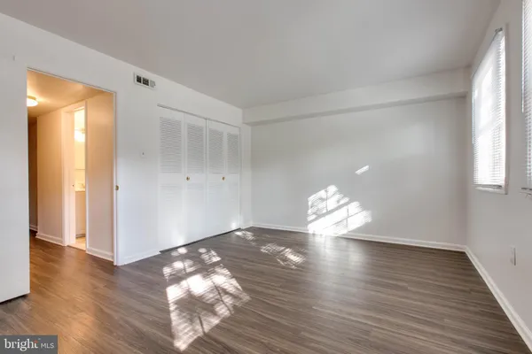 a very nice looking room with wooden floor