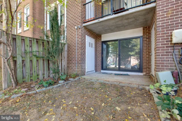 a view of a house with brick walls
