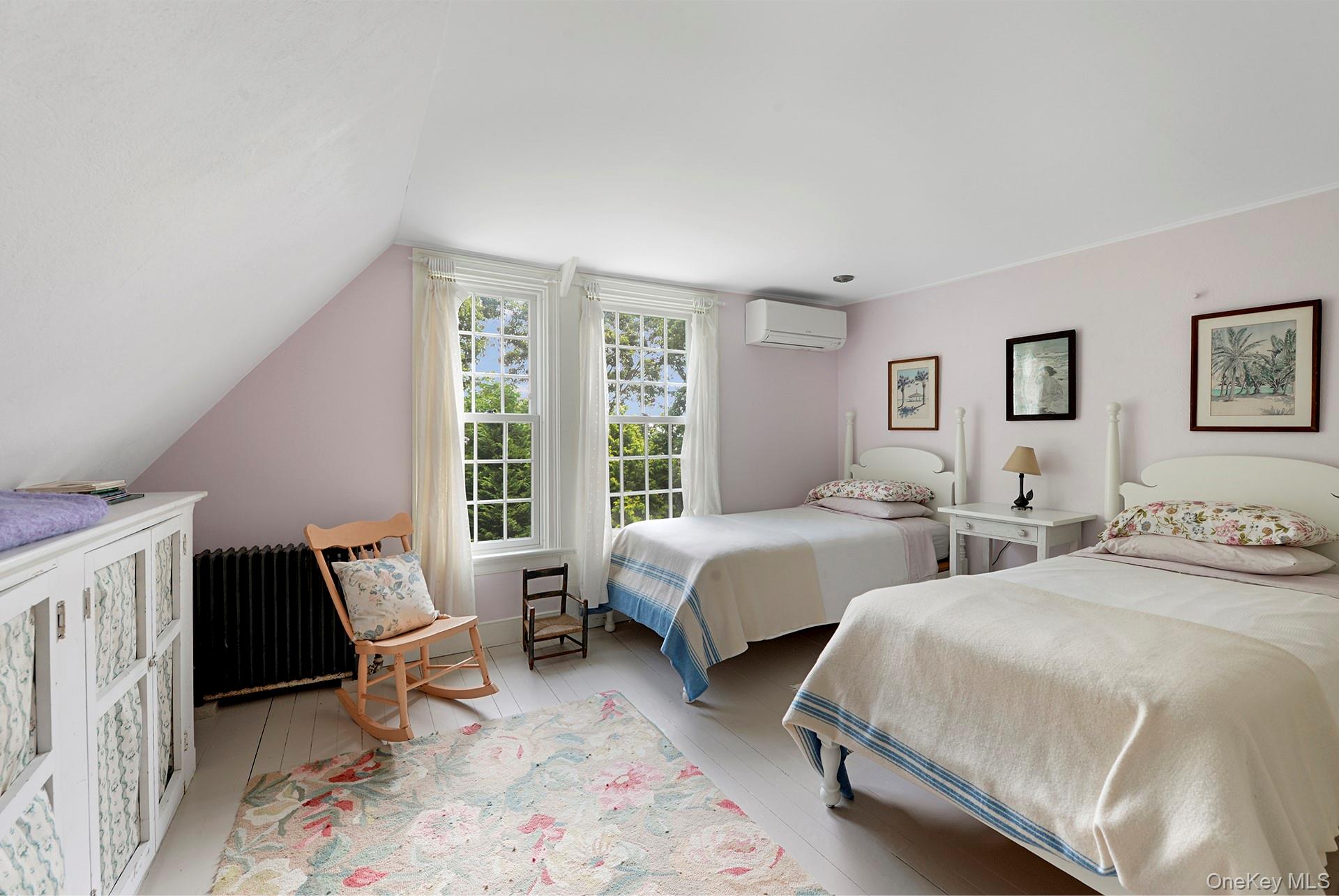 Undisclosed Address Peconic, NY 11958 - Photo 16 of 24 a bedroom with two beds and a couch