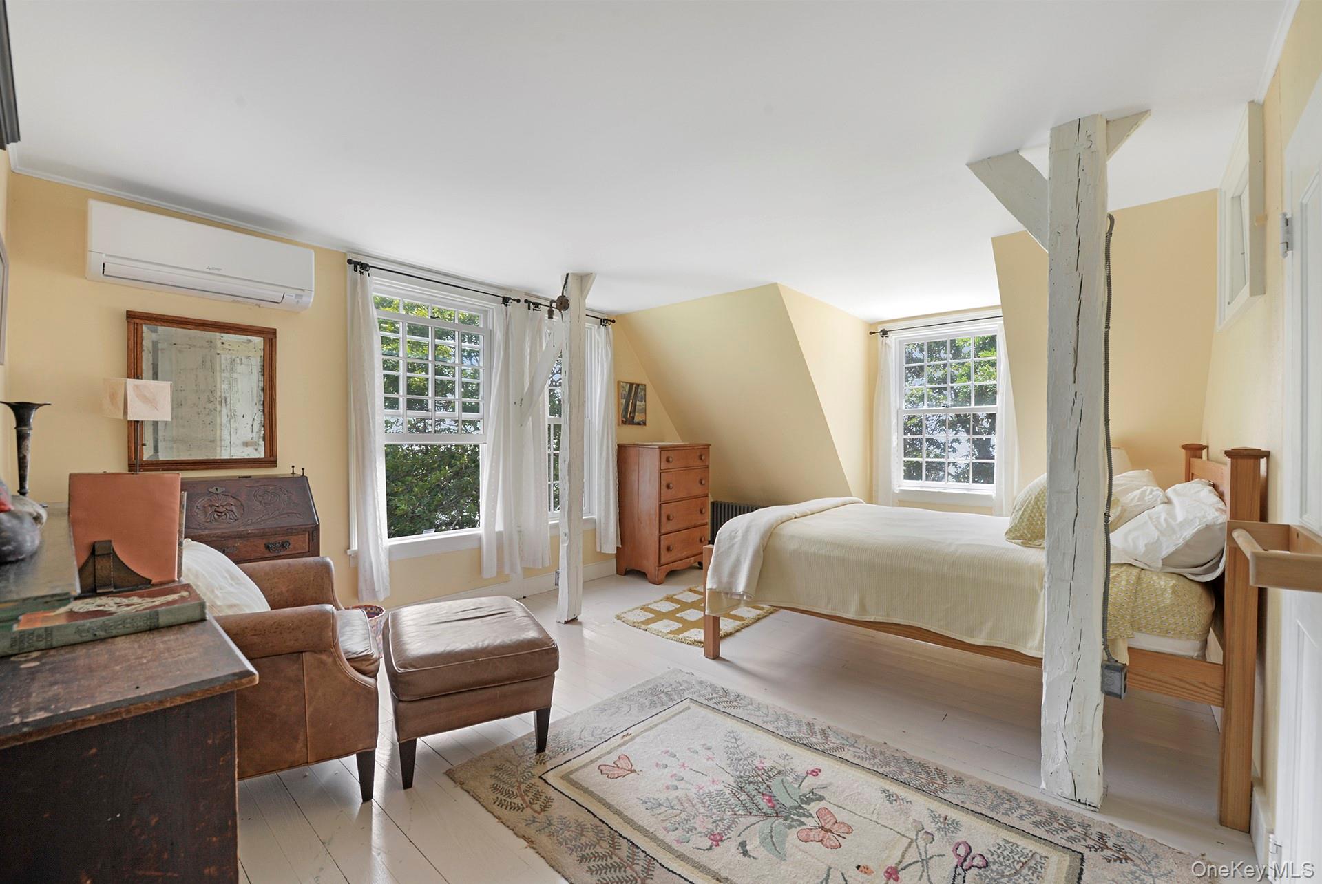 Undisclosed Address Peconic, NY 11958 - Photo 17 of 24 a bedroom with a bed and wooden floor