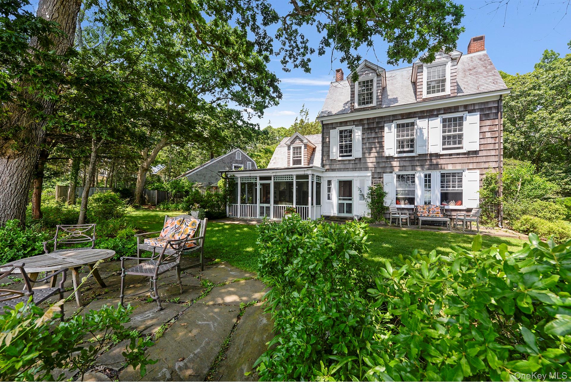 Undisclosed Address Peconic, NY 11958 - Photo 23 of 24 a view of a house with a yard and sitting area