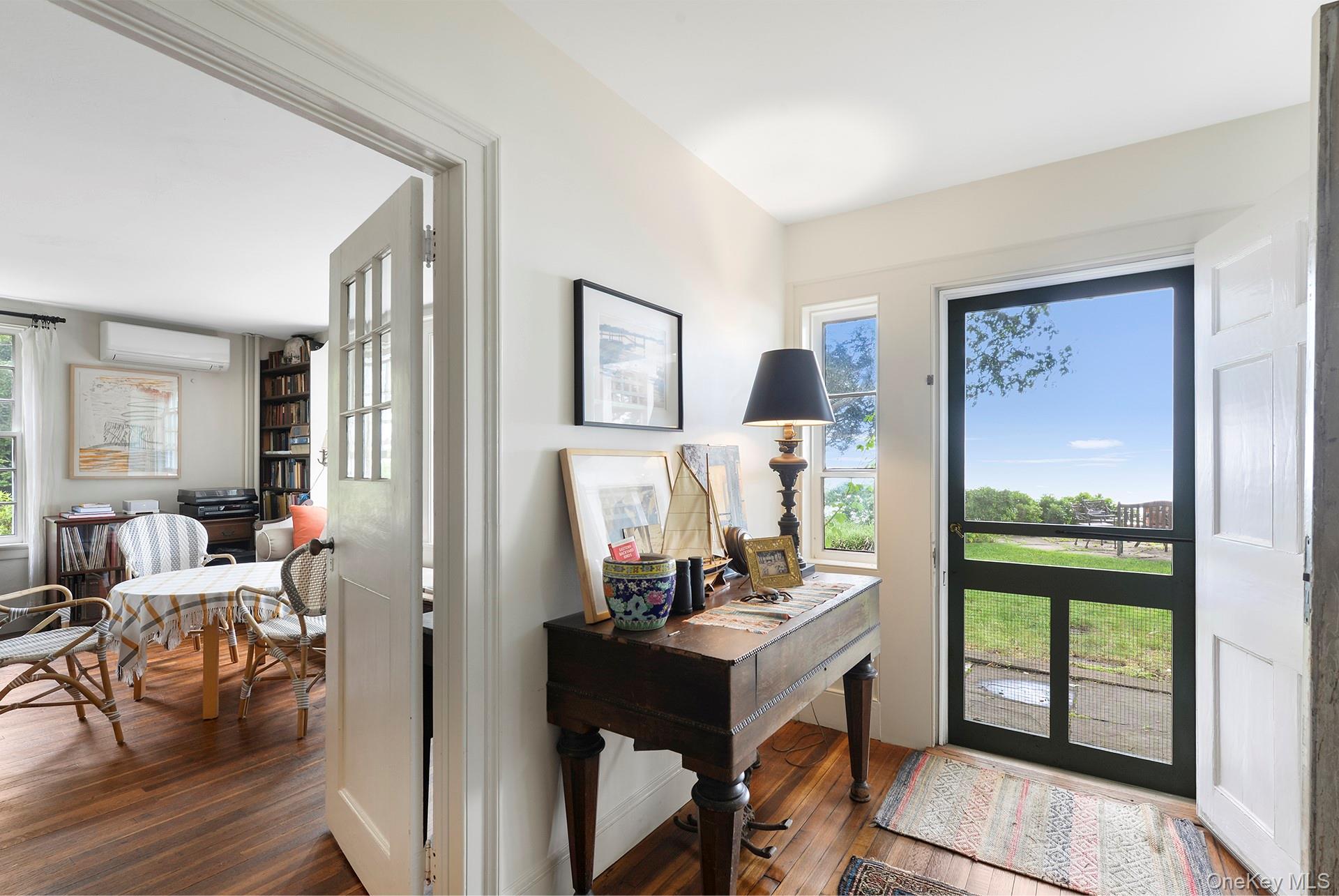Undisclosed Address Peconic, NY 11958 - Photo 5 of 24 a view of a workspace with furniture and a window