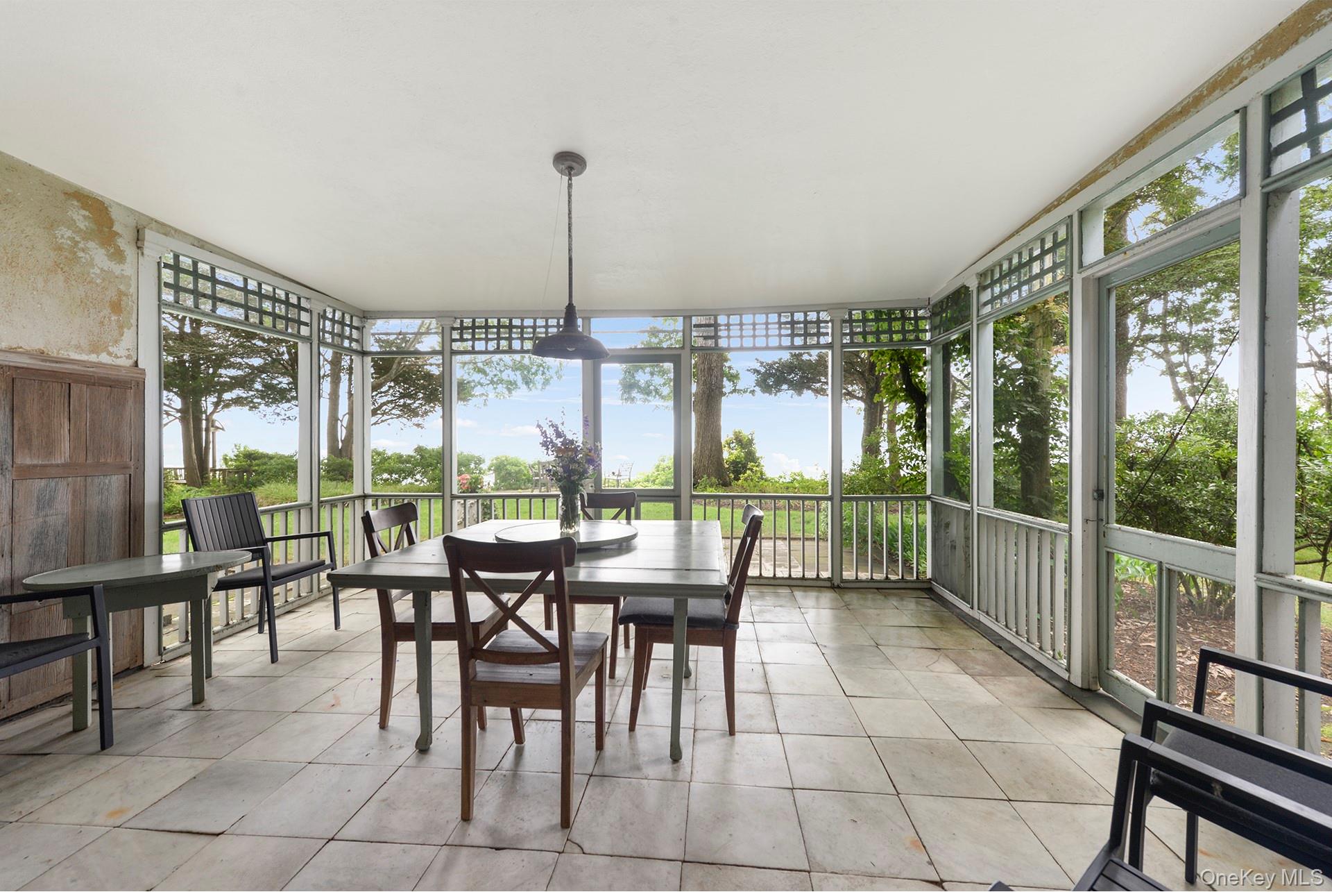 Undisclosed Address Peconic, NY 11958 - Photo 9 of 24 a view of a dining room with furniture window and outside view