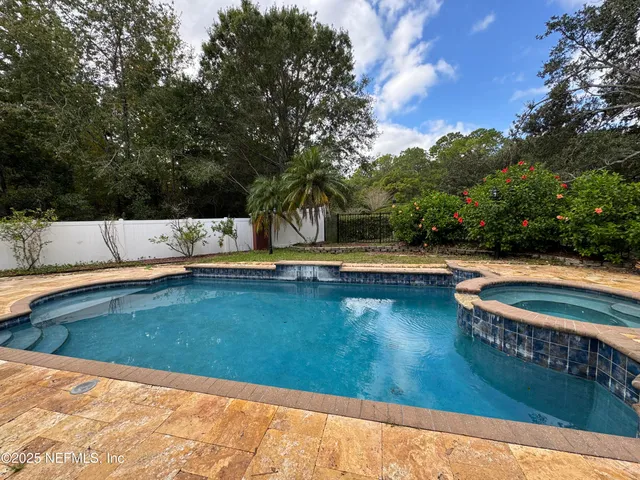 a kitchen with appliances and cabinets