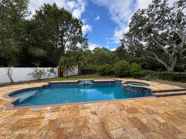 a view of a windows and chandelier in a room