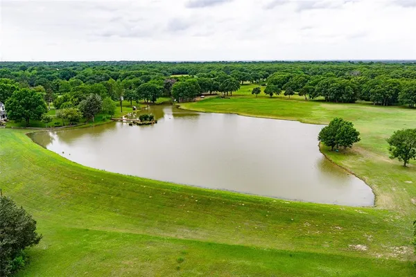a view of a lake with a big yard