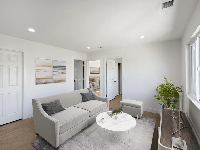 a living room with furniture and a table
