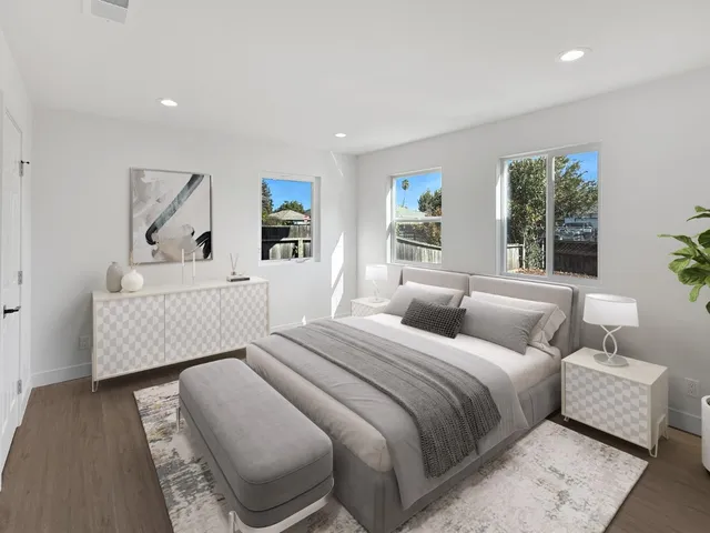 a bedroom with a bed and a couch