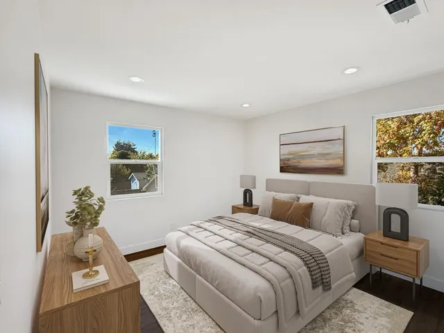 a bedroom with bed and a couch