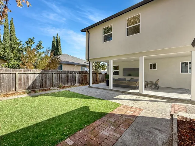 a house view with a backyard space