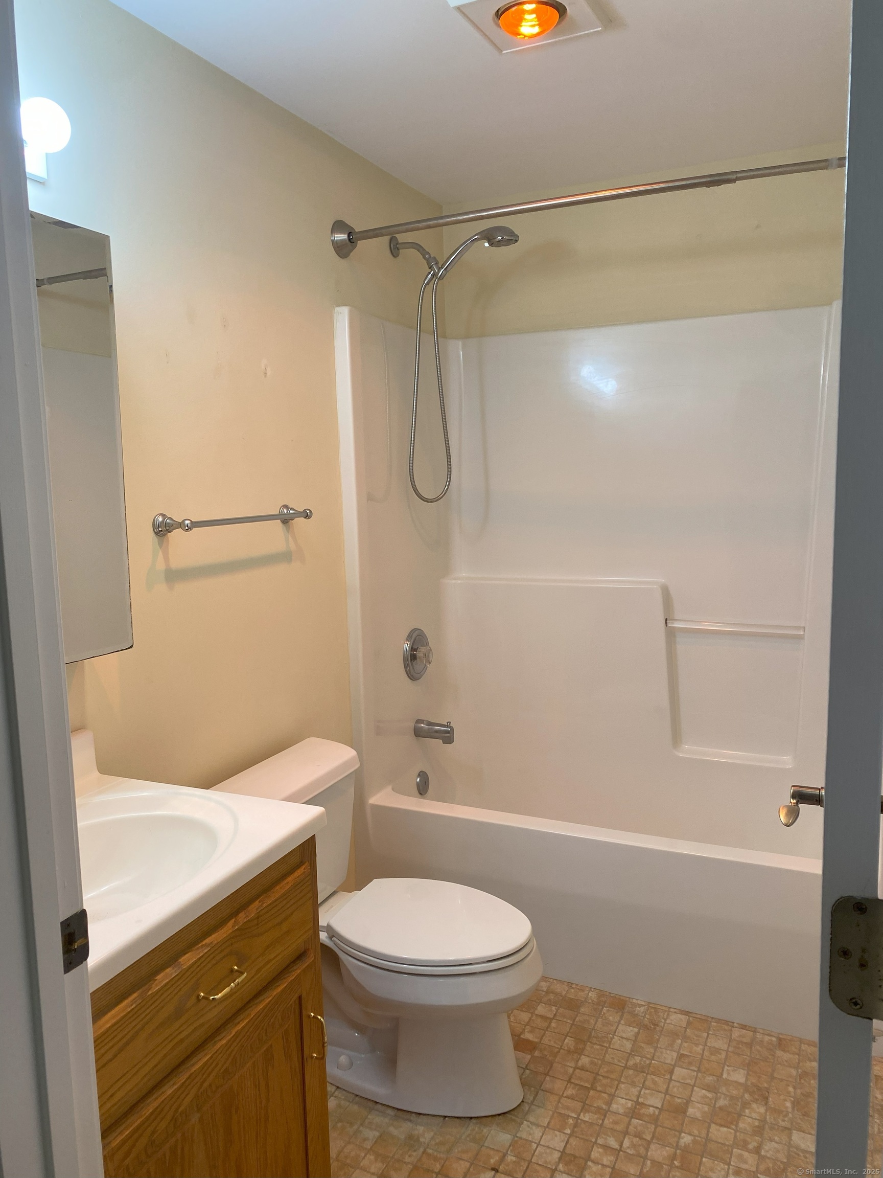 380 Main Street, Unit 14 Wallingford, CT 06492 - Photo 6 of 12 a bathroom with a toilet and shower