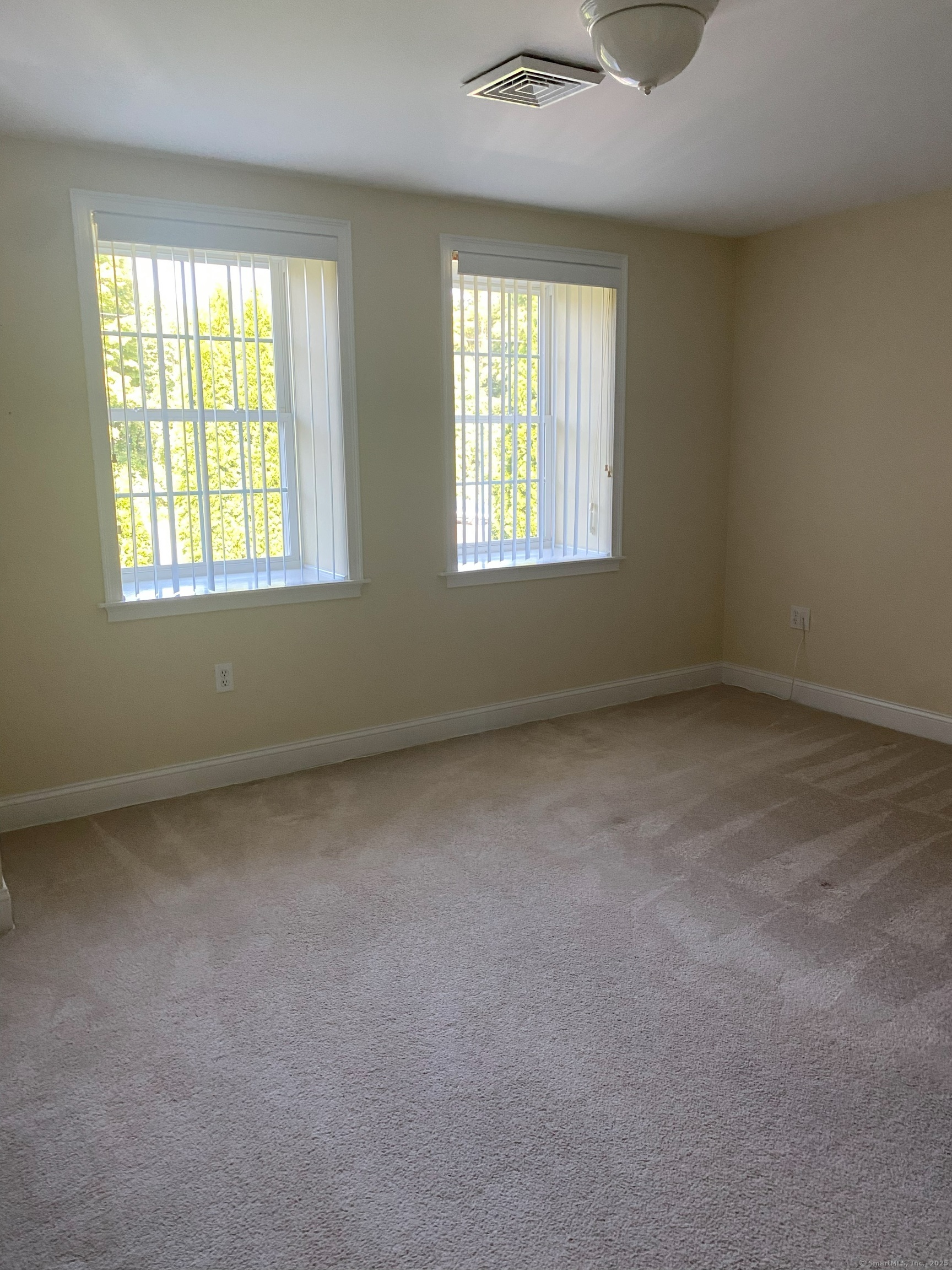 380 Main Street, Unit 14 Wallingford, CT 06492 - Photo 8 of 12 an empty room with windows