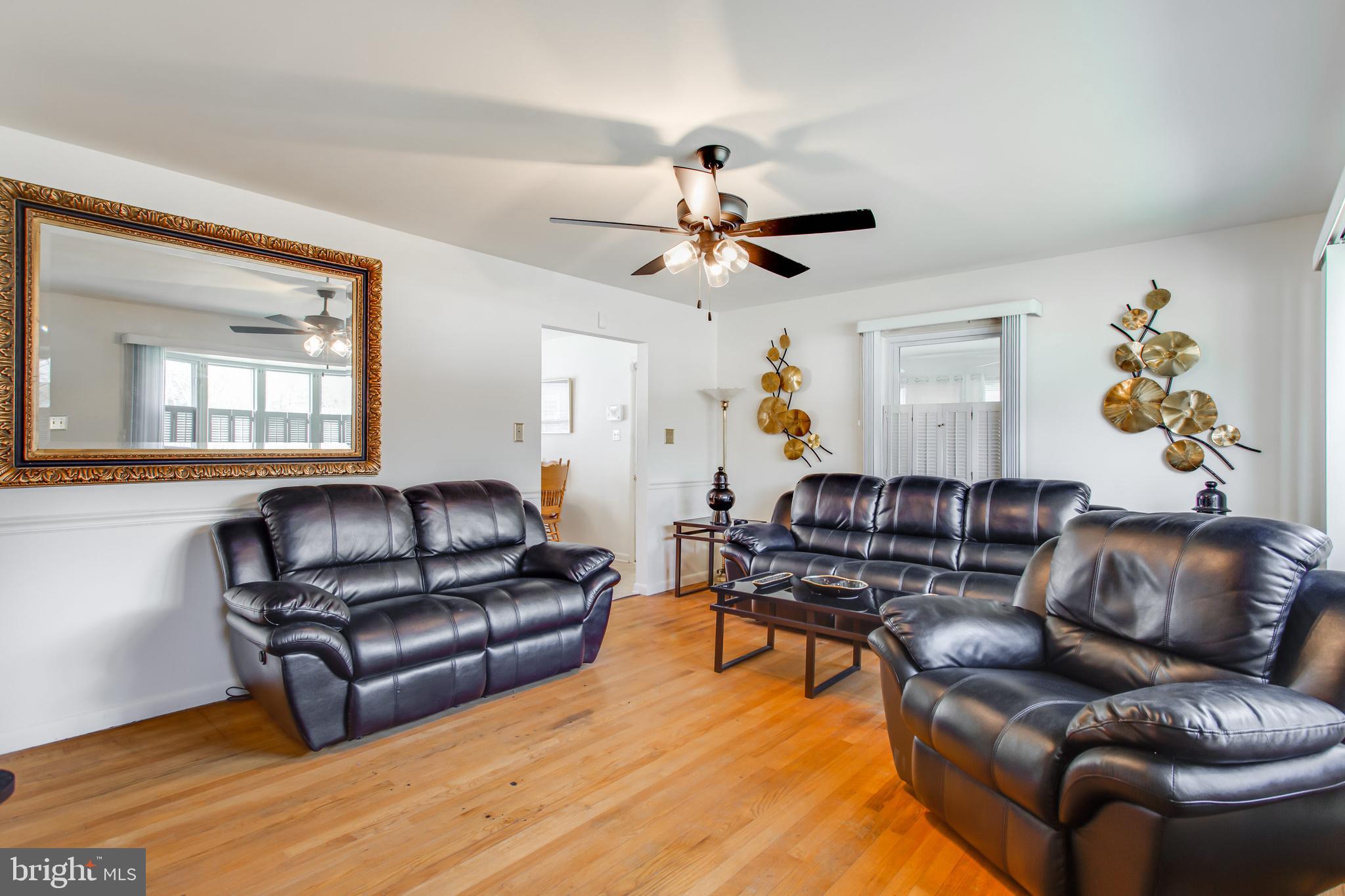 2784 Moran Drive Waldorf, MD 20601 - Photo 55 of 65 a living room with furniture ceiling fan and a wooden floor