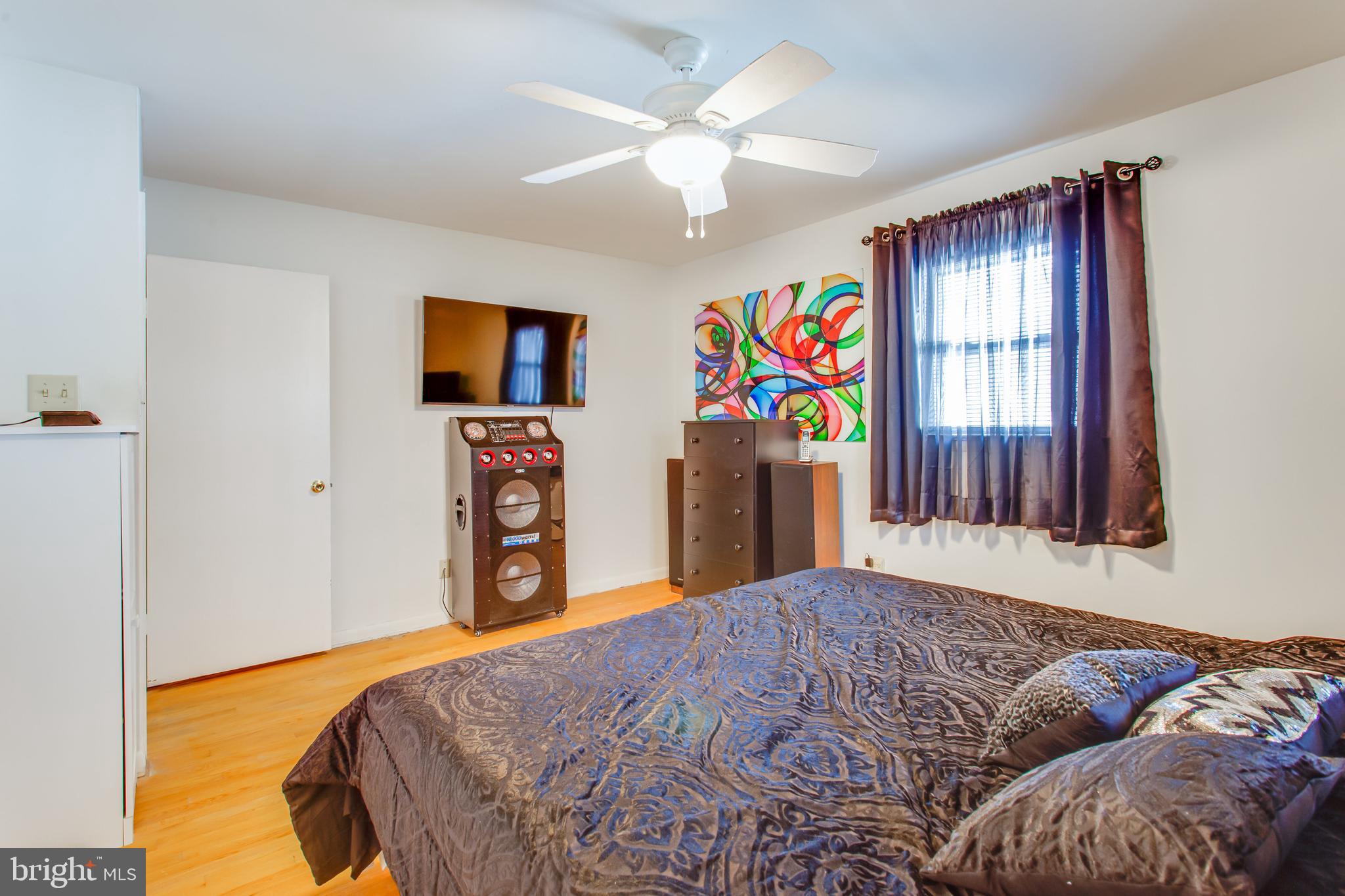 2784 Moran Drive Waldorf, MD 20601 - Photo 61 of 65 a bedroom with a bed and a flat screen tv