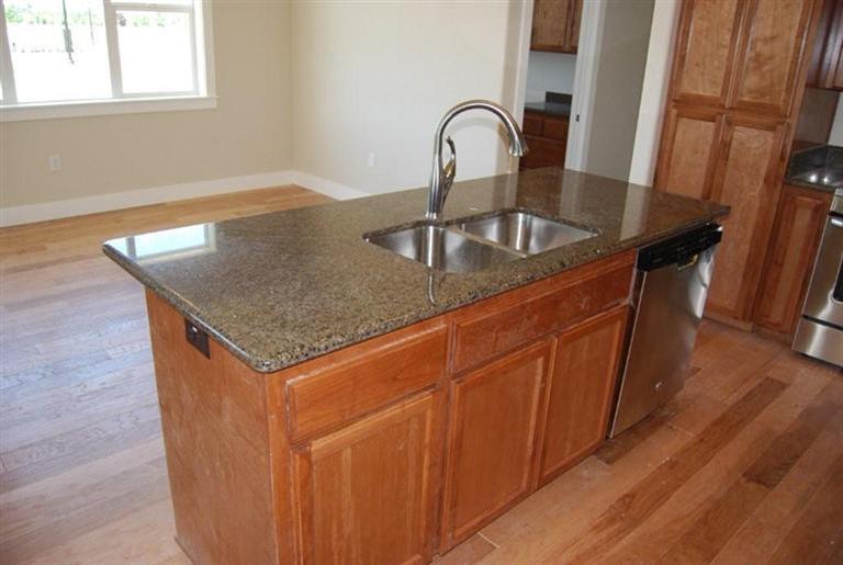 1117 Boulder Ridge Street Central Point, OR 97502 - Photo 3 of 19 a close view of sink and tap