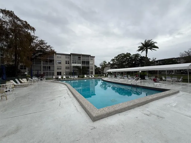 a view of a swimming pool with a patio