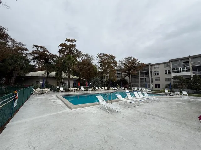 a view of a playground with basketball court