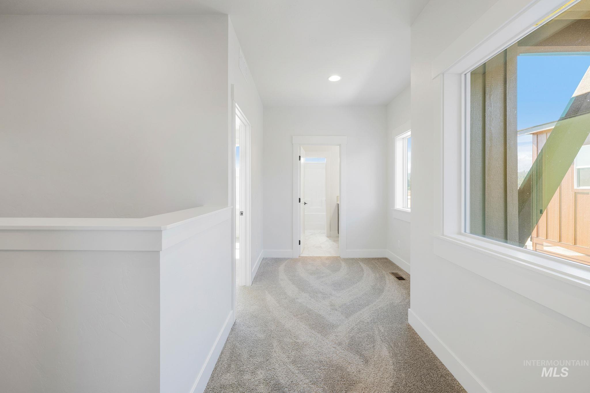 24 Bridger Street Cascade, ID 83611 - Photo 28 of 39 Hall with light carpet and recessed lighting