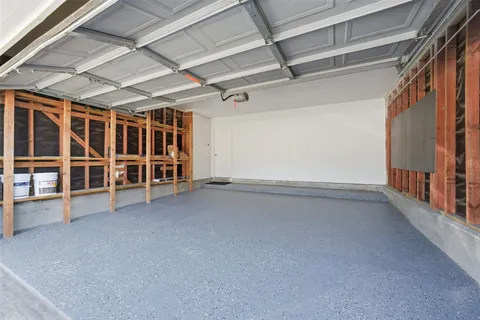 a view of backyard of house with seating space