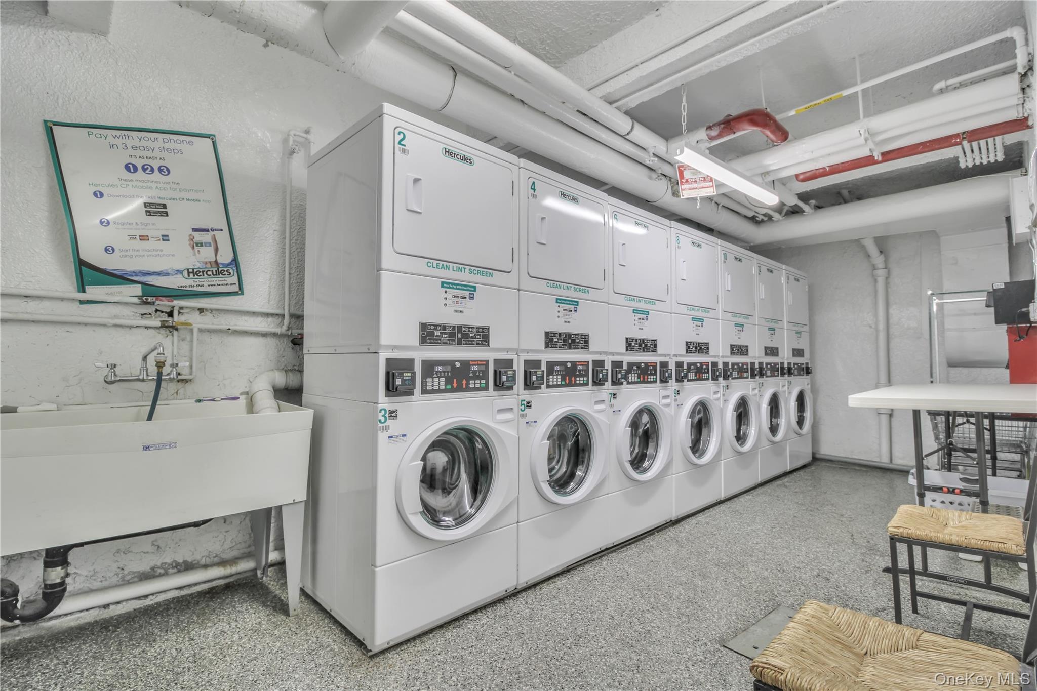 35-40 75th Street, Unit 5B Queens, NY 11372 - Photo 13 of 20 a utility room with dryer and washer