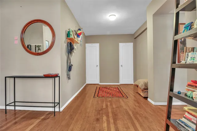 a view of an entryway with wooden floor