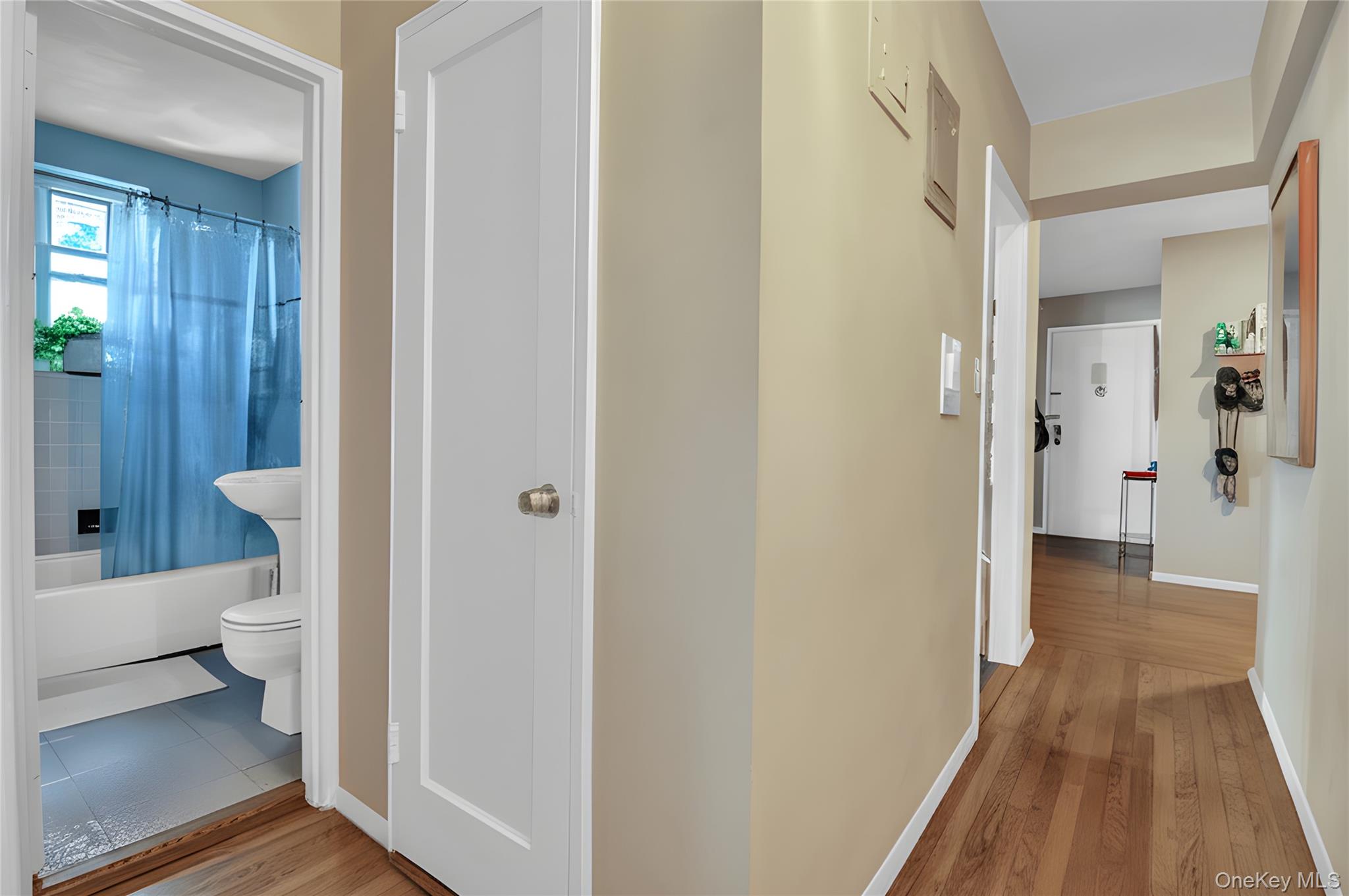 35-40 75th Street, Unit 5B Queens, NY 11372 - Photo 5 of 20 a view of a bathroom from a hallway