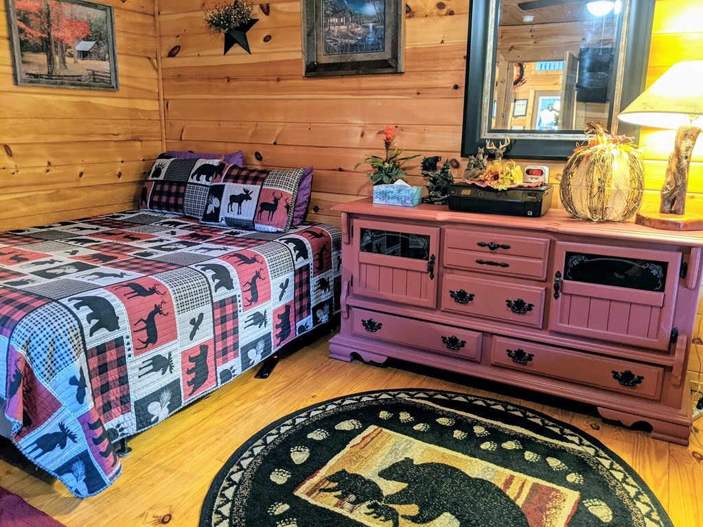 447 Hideaway Ridge Circle Sevierville, TN 37862 - Photo 10 of 27 a bed room with a bed and a mirror