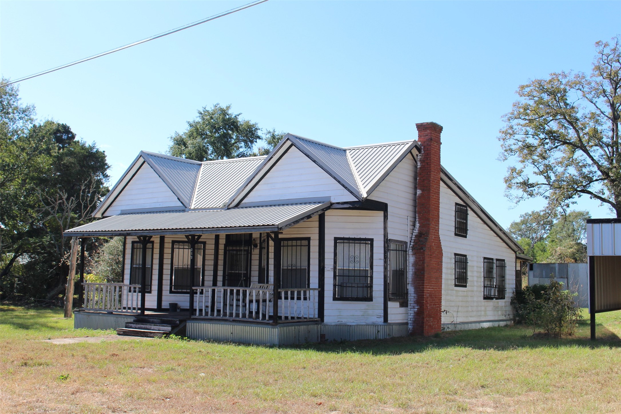 312 North Howard Street Grapeland, TX 75844 - Photo 3 of 29 a view of a house with a yard